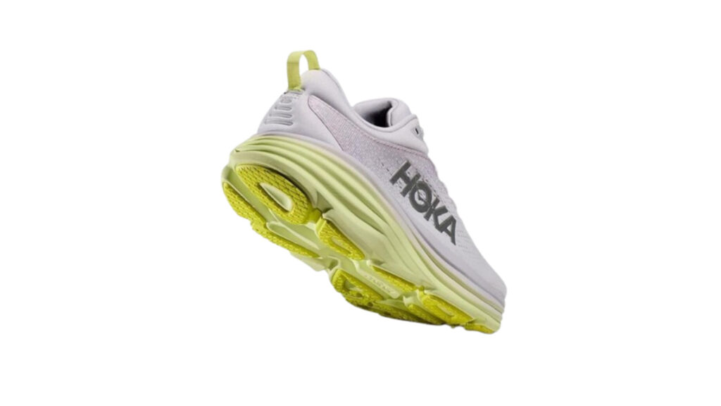 An intricate cross-section of the HOKA ONE ONE Bondi 8 midsole, showcasing its high-stack construction and responsive technology. The midsole appears in the foreground, cast in soft, even lighting that accentuates its contoured layers and materials. In the background, a minimalist grey backdrop provides clean contrast, allowing the midsole's design to take center stage. The perspective is slightly elevated, providing a clear view of the midsole's internal structure and shock-absorbing elements. The overall mood is one of technical precision and quality craftsmanship, reflecting the advanced cushioning and support of the Bondi 8.